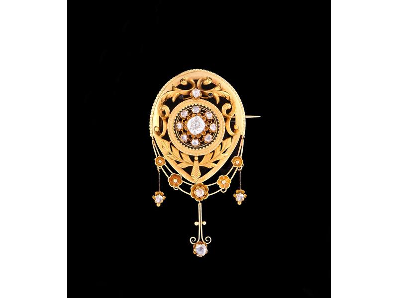 BROCHE articulée en or jaune (750) à décor...