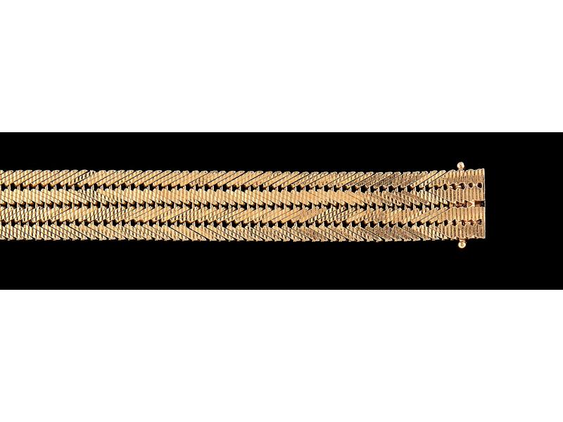 BRACELET SOUPLE en or (750) à quatre rangs...