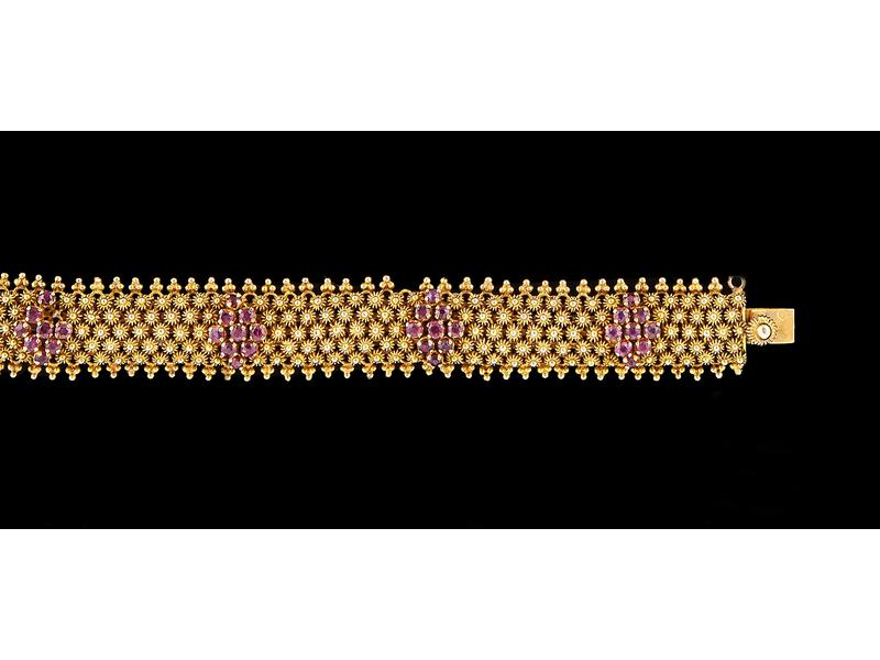 BRACELET souple articulé en or jaune (750)...
