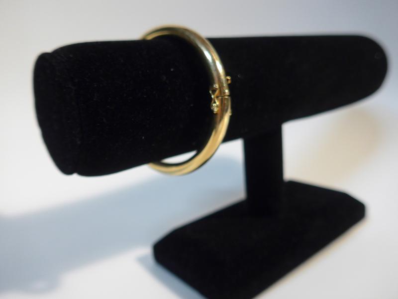 BRACELET jonc rigide articulé en or jaune...