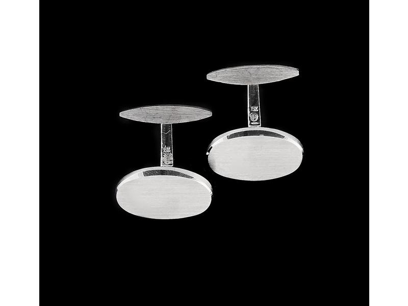 PAIRE DE BOUTONS DE MANCHETTES ovales à pans...