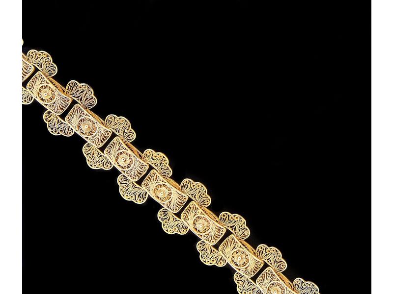 BRACELET en or jaune (750) filigranné à décor...