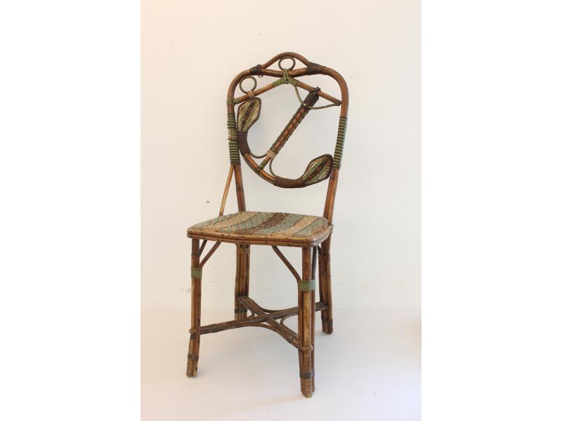 CHAISE en rotin rehaussé brun et vert, le...