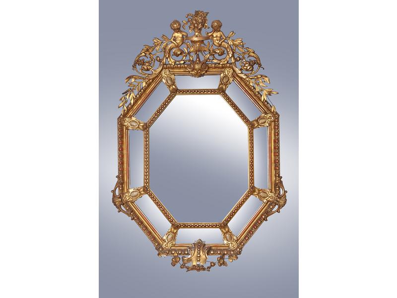 MIROIR octogonal en bois et stuc doré, à...