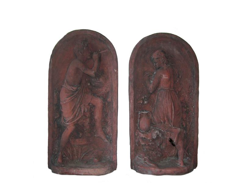 PAIRE DE BAS-RELIEFS en terre cuite,