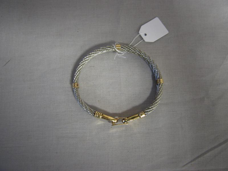 BRACELET rigide à deux liens en acier réunis...
