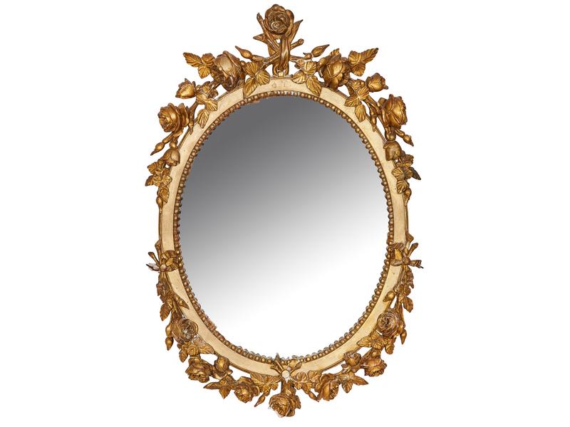 MIROIR ovale en bois et stuc doré à frises...