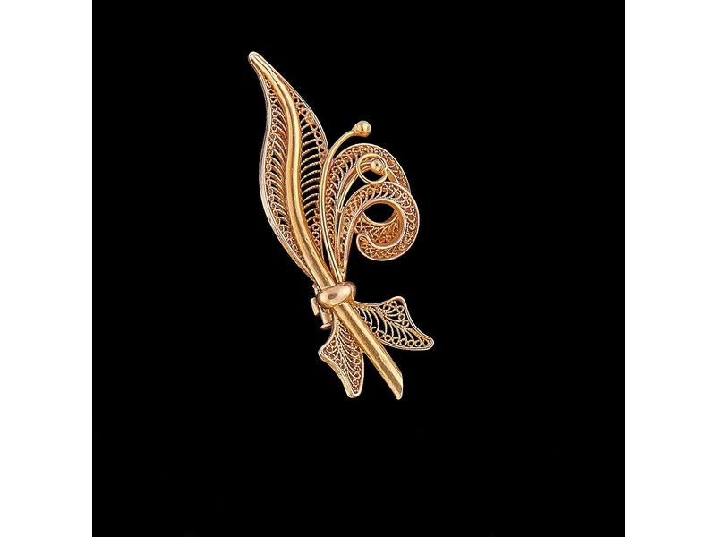 BROCHE en or jaune (18K) représentant une...