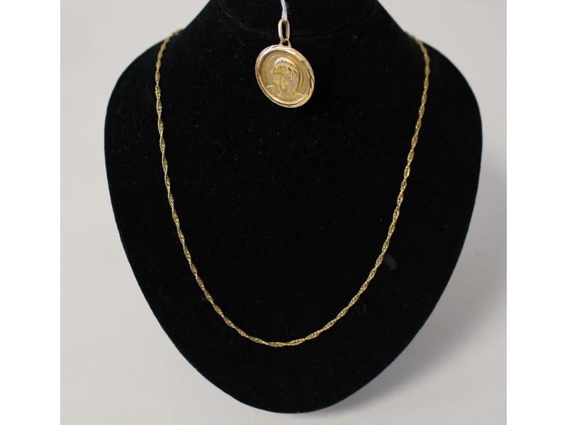 MEDAILLE ronde en or jaune (18K) représentant...