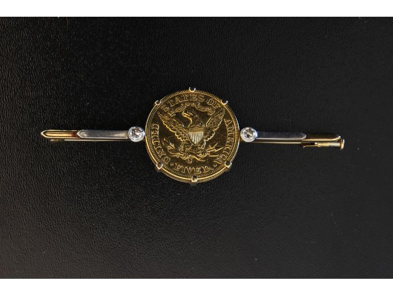 BROCHE BARRETTE en platine et or jaune (18K)...
