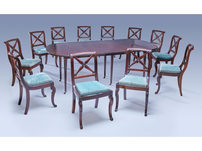 DOUZE CHAISES en acajou et placage d'acajou,...