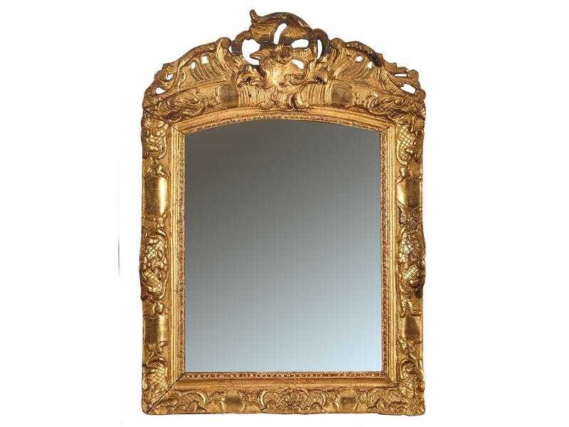 MIROIR au mercure cintré en partie supérieur...