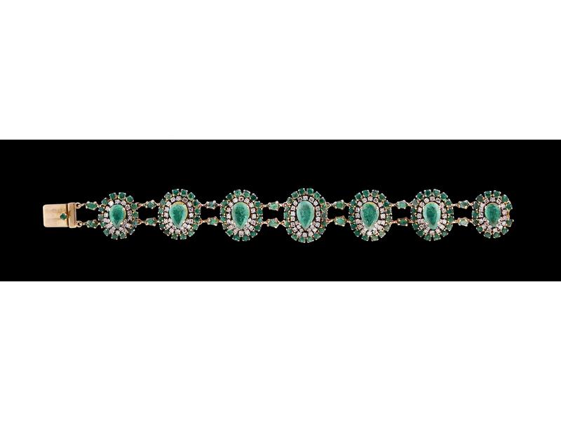 BRACELET en or jaune (18K) formé de sept...