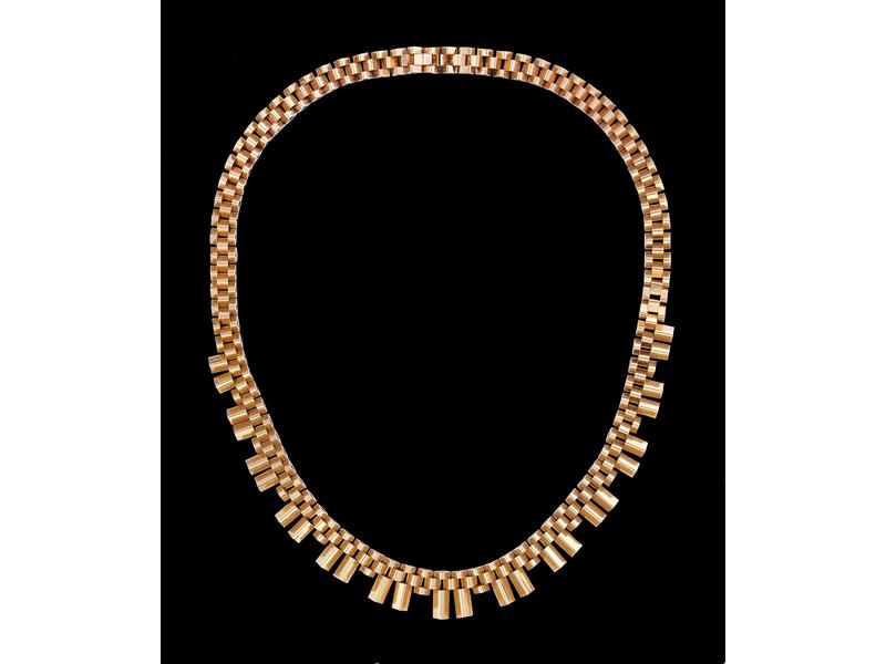 COLLIER en or jaune (18k) à maillons baguettes...