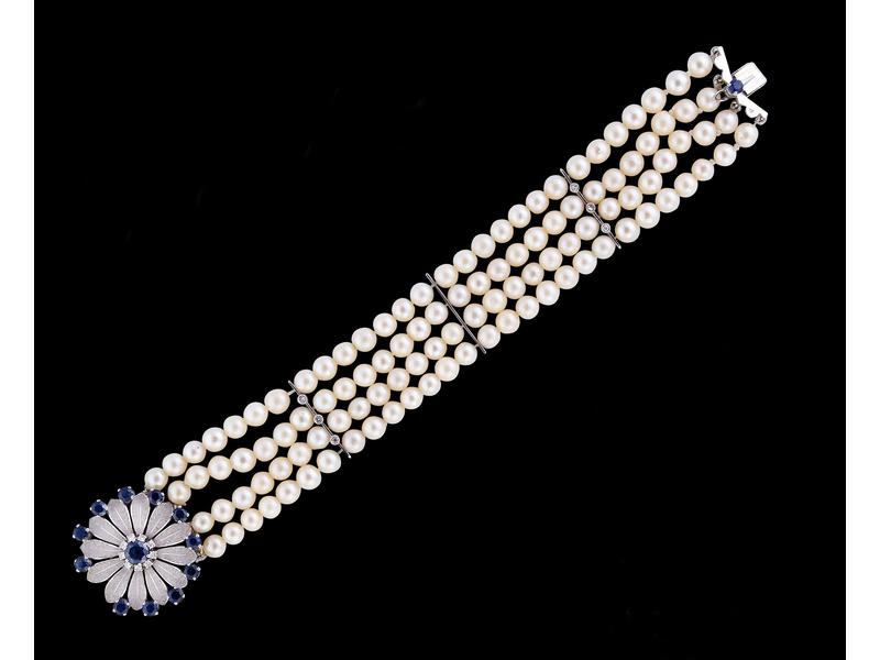 BRACELET en or gris (18k) à quatre rangs...