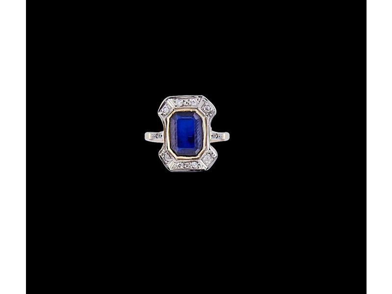 BAGUE en ors jaune et gris (18k) sertie d'un...