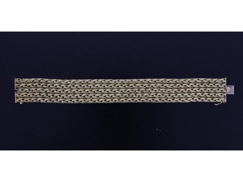 BRACELET souple en or jaune (18K) tressé...