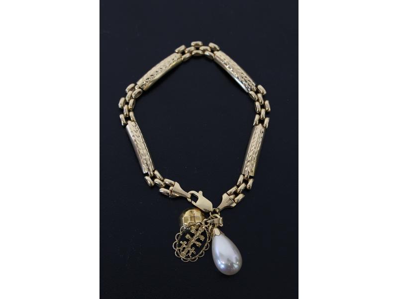BRACELET en or jaune (18K) à maillons baguettes...