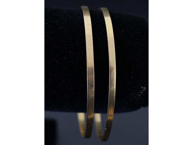 PAIRE DE BRACELETS rigides en or jaune (...
