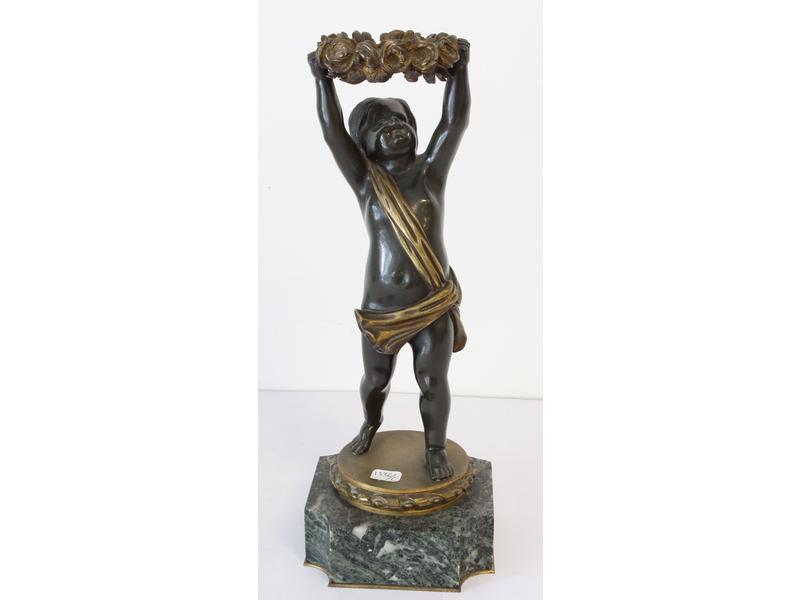 PUTTO en bronze à deux patines portant une...