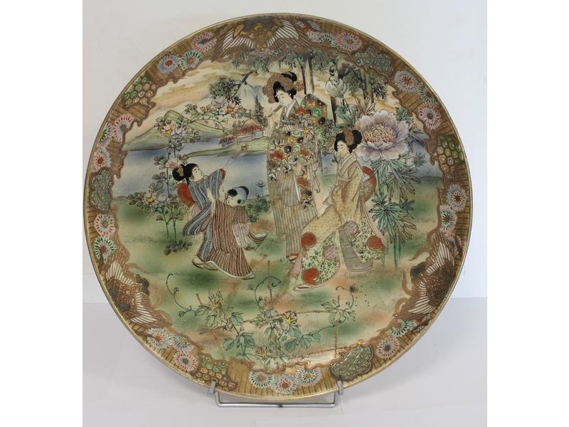 PLAT circulaire en grès émaillé polychrome...