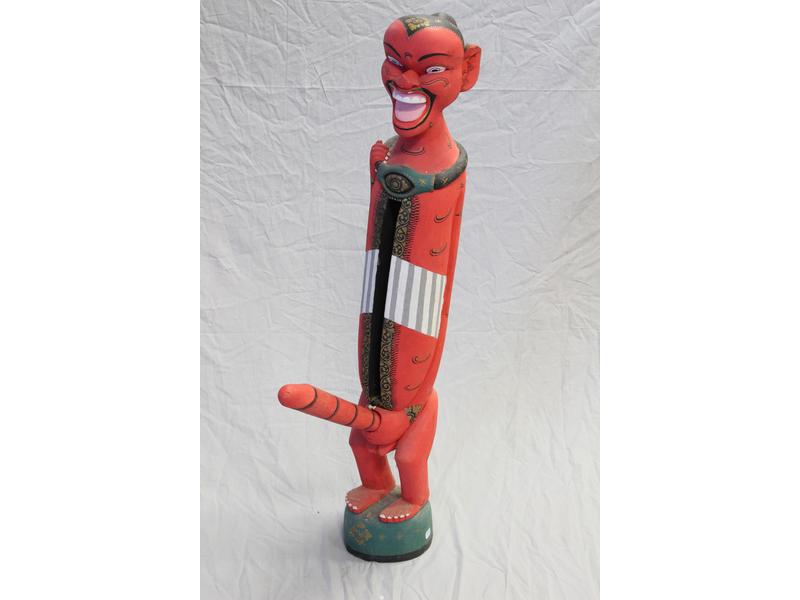 TAMBOUR A FENTE représentant une figurine...