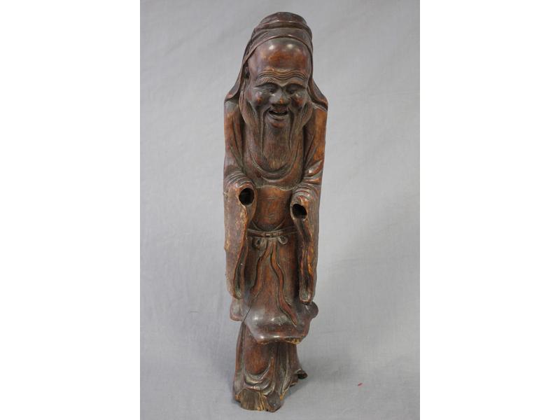 GRAND PERSONNAGE en bois exotique sculpté,...
