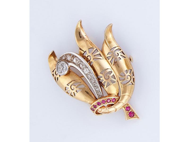 BROCHE en or jaune (18K) stylisant un plumet...