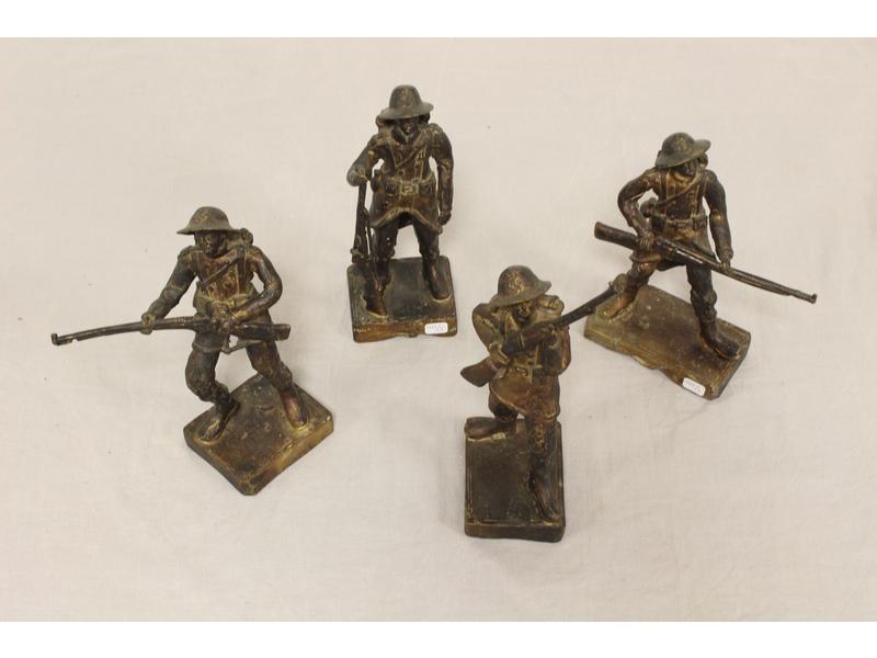 SUITE DE QUATRE SOLDATS COLONIAUX en bronze...