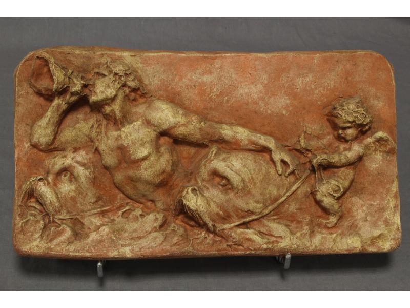 PLAQUE en terre cuite à décor en bas-reliefs...