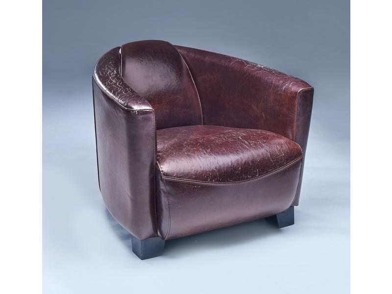 FAUTEUIL CLUB en cuir brun, trois pieds en...