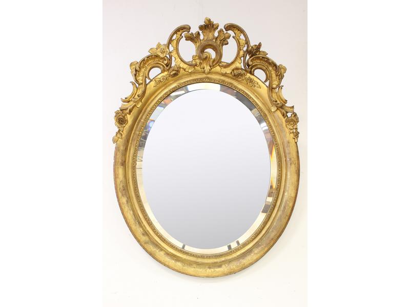 MIROIR biseauté ovale dans un cadre en bois...