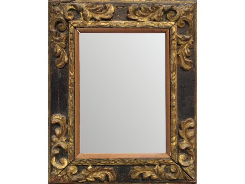 MIROIR dans un cadre en bois sculpté patiné...