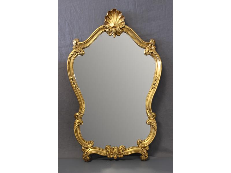 MIROIR de forme chantournée dans un cadre...