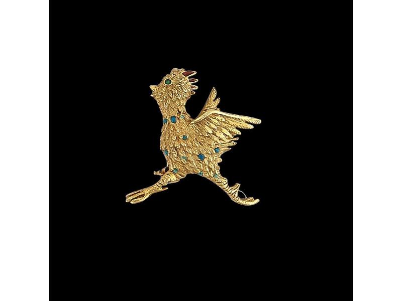 PETITE BROCHE en or jaune 18K représentant...