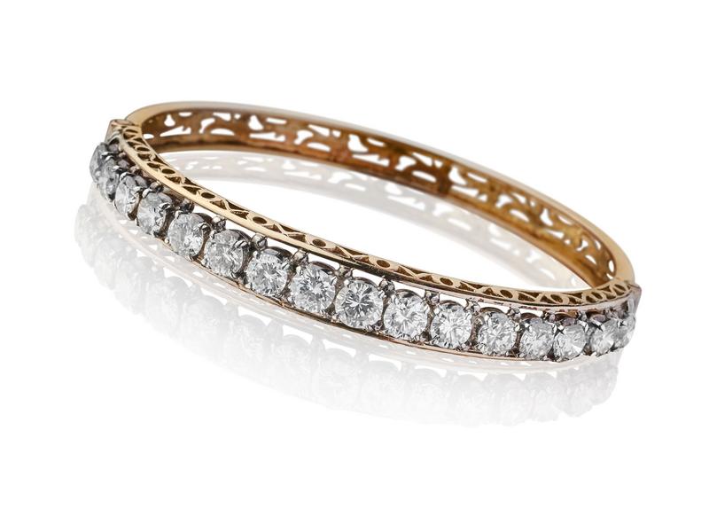 BRACELET rigide en or jaune (18k) ajouré...