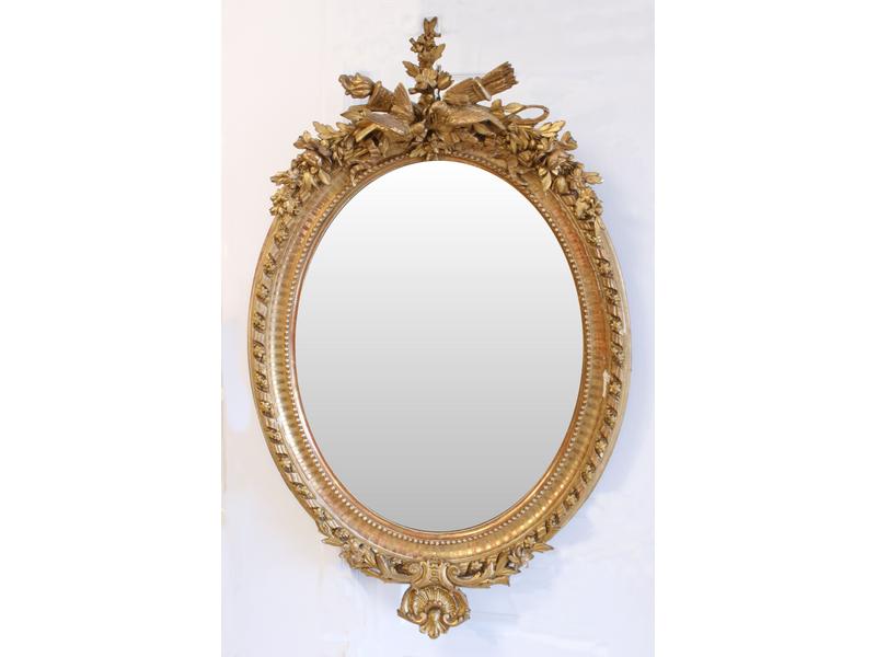 MIROIR ovale biseauté dans un cadre en bois...
