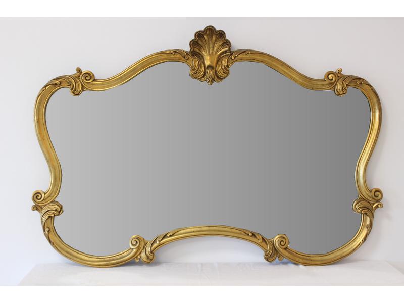MIROIR de forme chantournée dans un cadre...