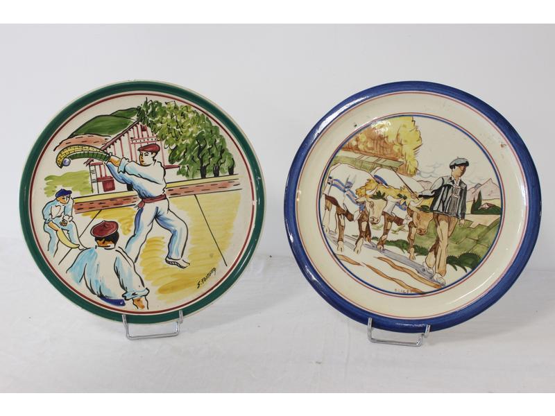 DEUX PLATS en faïence émaillée polychrome,...