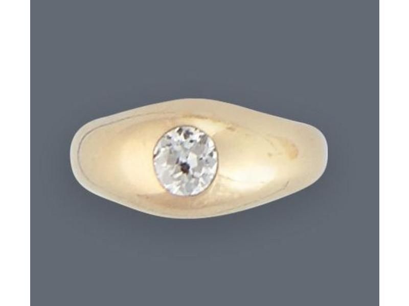BAGUE jonc en or jaune (750) ornée d'un diamant...