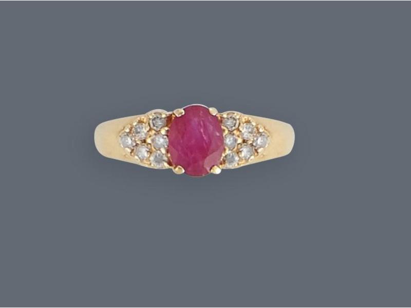 BAGUE jonc en or jaune (750) ornée d'un rubis...