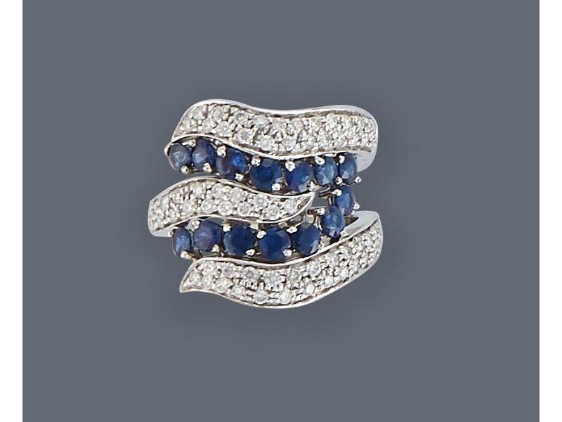 BAGUE en or gris (750) stylisant une vague,...