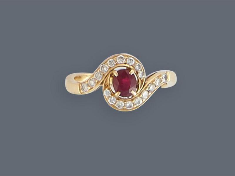 BAGUE tourbillon en or jaune (750) sertie...