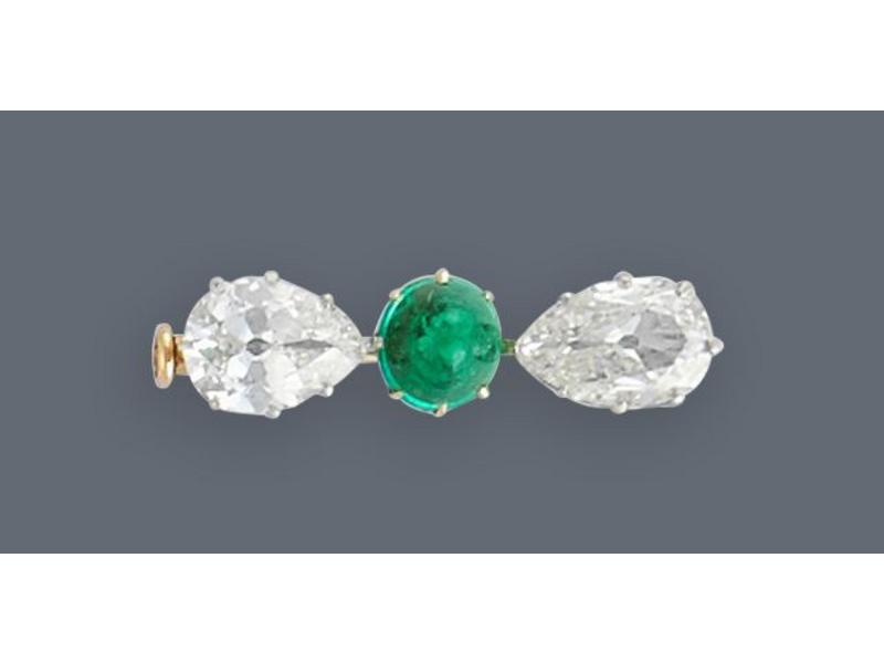 BROCHE en or jaune (750) sertie de deux diamants...
