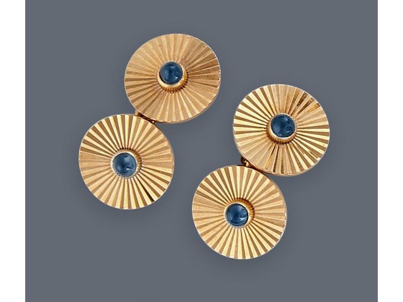 PAIRE DE BOUTONS DE MANCHETTES ronds en or...
