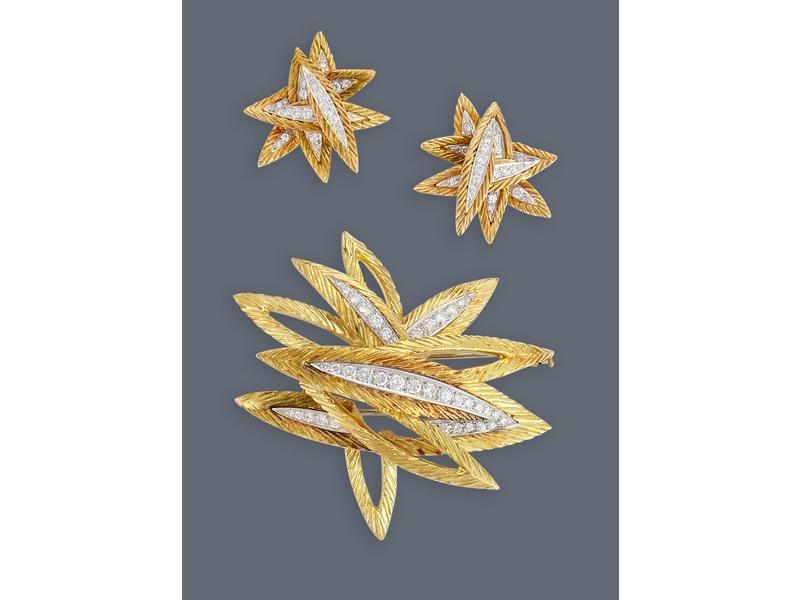 PARURE en or jaune (750) et platine, stylisant...