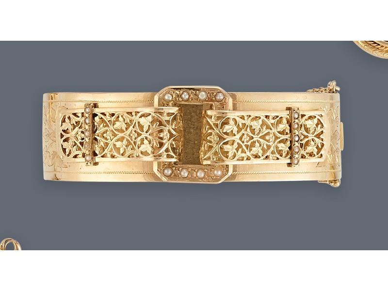 BRACELET rigide articulé en or jaune (750)...