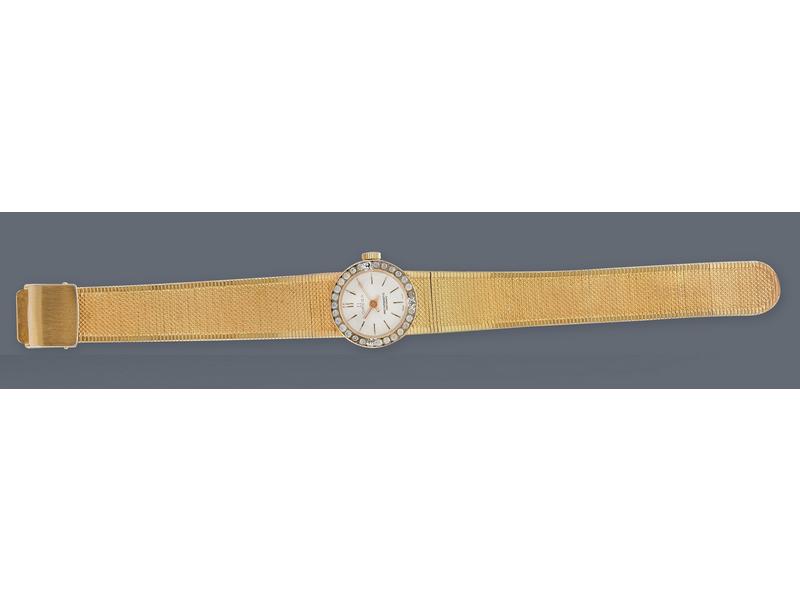 MONTRE bracelet de dame en métal doré à bracelet...