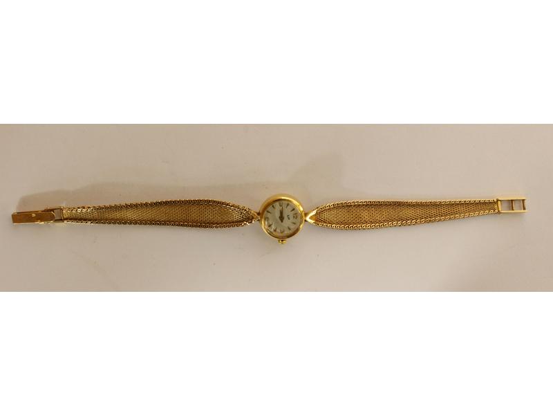 PETITE MONTRE BRACELET de dame en or jaune...