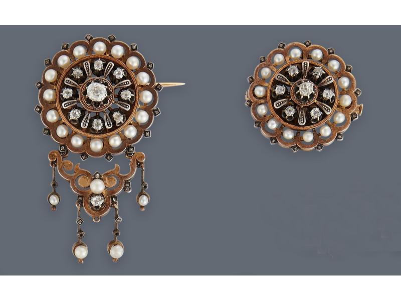 BROCHE rosace en or jaune (750) sertie de...